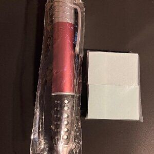 big pen with sticky  pads